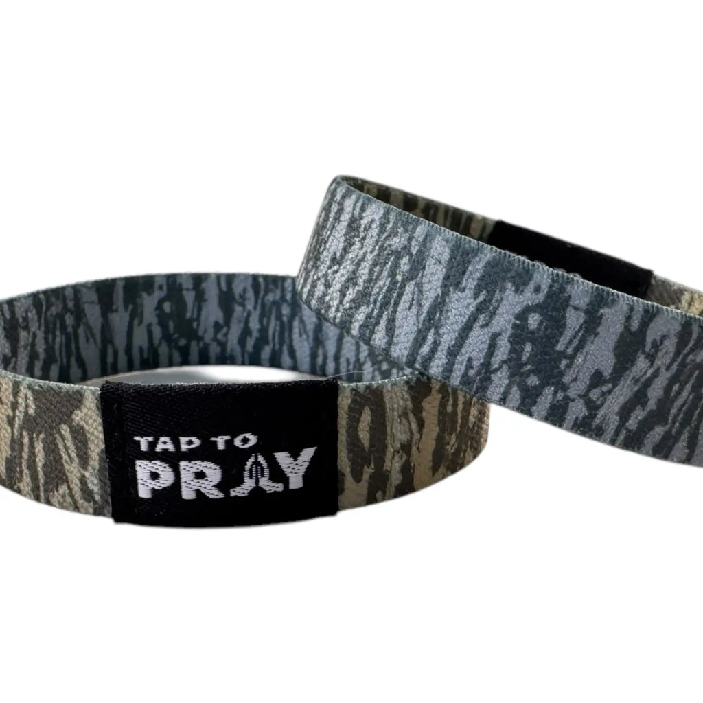 Two wristbands with camouflage pattern and 'Tap to Pray' text on a white background