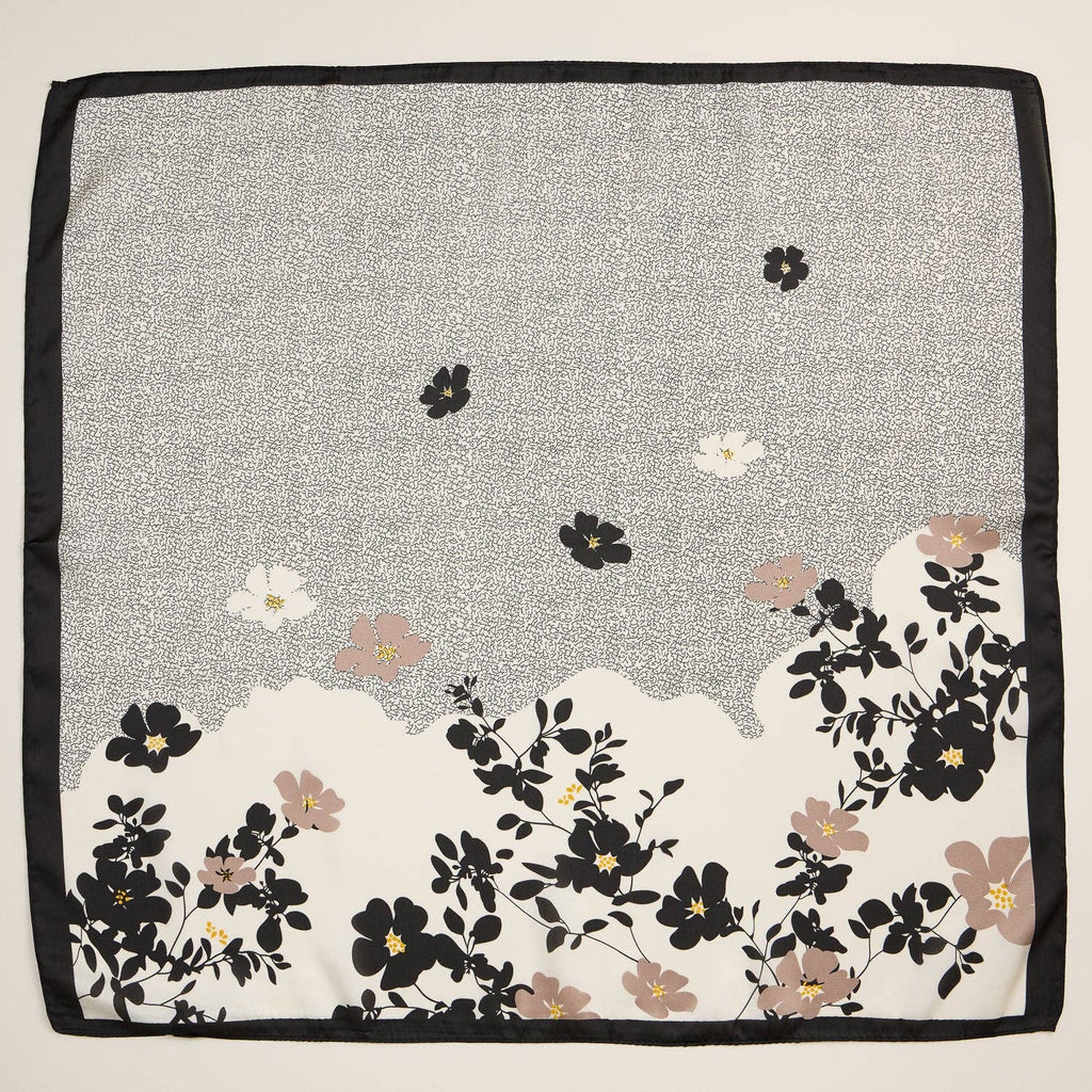 Black and grey silk-texture square scarf with minimalist floral print and black border.
