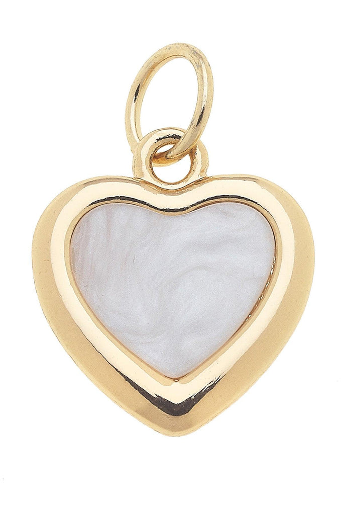 Gold heart-shaped pendant with a white center on a white background