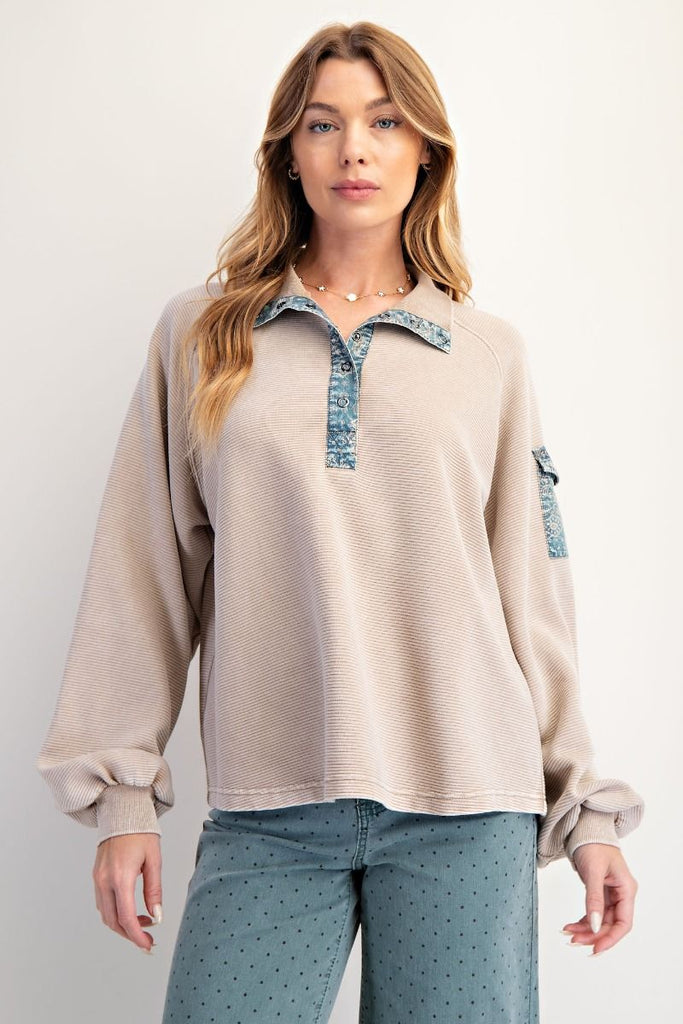 Khaki textured pullover with denim collar, half button placket, and sleeve pocket detail, styled in a relaxed fit boutique casual look.
