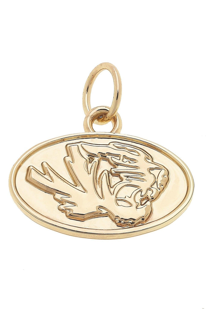Gold pendant with a detailed design on a white background