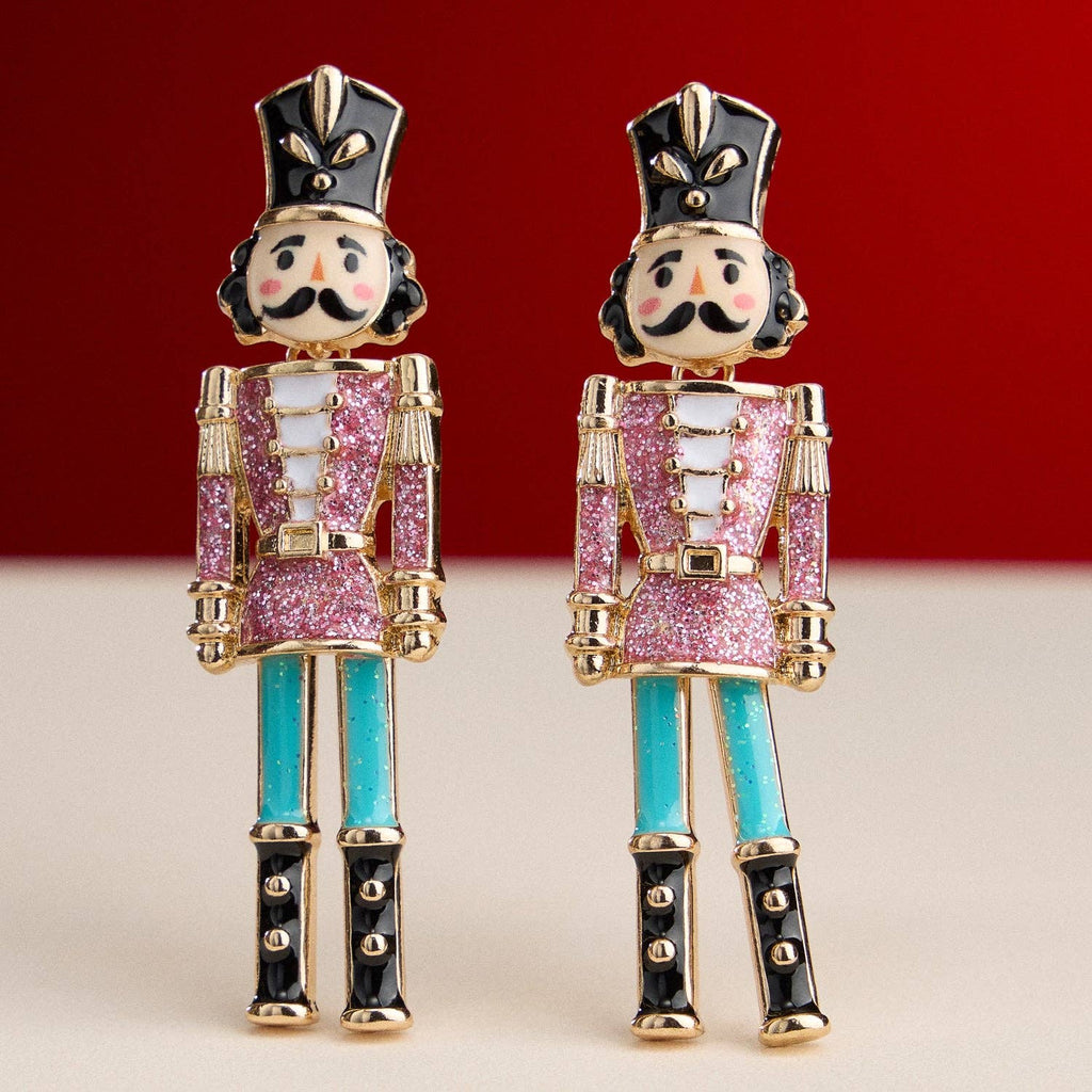 Colorful nutcracker enamel earrings with glitter accents and titanium posts.