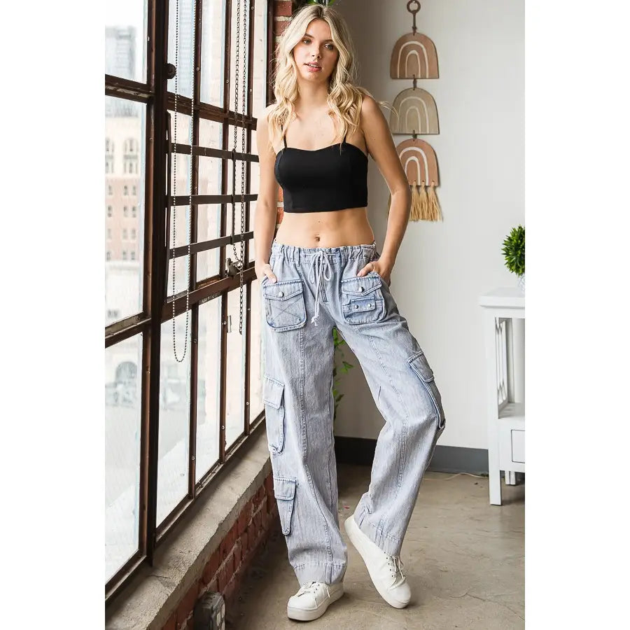 Light denim mineral washed cargo pants with drawstring waist and multiple pockets. oli & hali