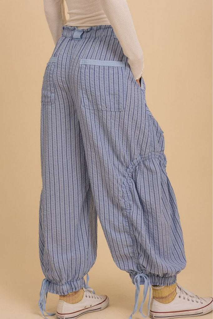 100% breathable cotton with a soft mineral-washed finish

Low-slung, oversized fit for relaxed comfort

Elastic waistband with adjustable drawstring

Utility-style dropped cargo pockets and back pockets

Ruched drawstring detailing at the legs and hem

Contrast twill tape accents add subtle edge