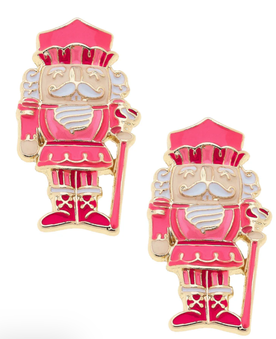 Pink and gold nutcracker earrings on a white background