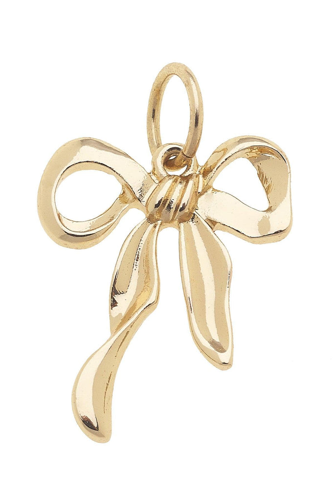 Gold bow-shaped pendant on a white background