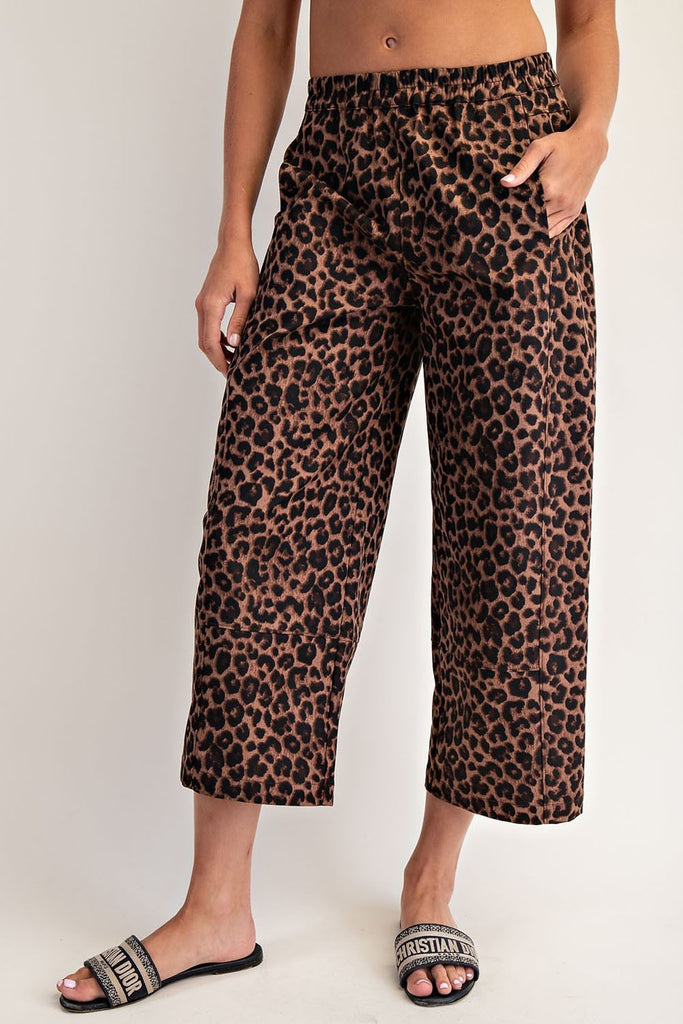 Close-up of soft washed leopard print cropped pants with elastic waistband and straight-leg silhouette.
