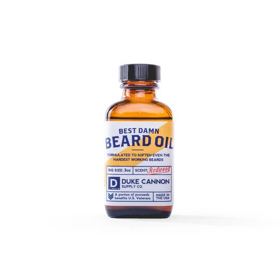 There is a fine line between the unruly beard of a grizzled mountain hobo and the dashing beard of a world champion. Go from unkempt to "kempt" with Duke Cannon's Best Damn Beard Oil. Made with premium natural ingredients such as Apricot kernel, argan, and jojoba oils, it's formulated to soften even the hardest working beards. Features the scent of freshly split cedar, making you feel like you're on a walk through the Redwoods. 